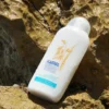 Body Milk de Avena kamel sobre roca en la playa