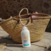 Body milk de Avena Kamel junto a un capazo de playa